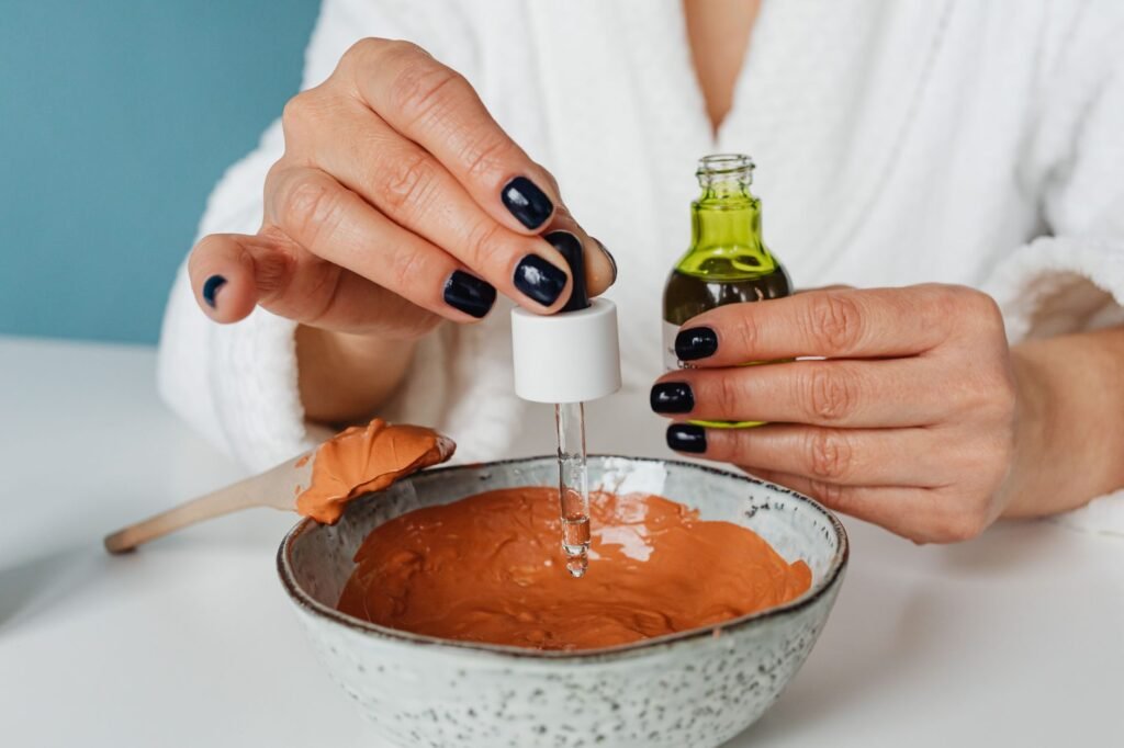 Applying cuticle oil to repair nails after gel removal